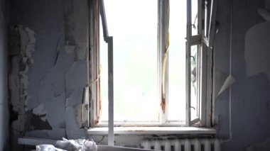 The apartment of the inhabitants after the evacuation during the bombing of a peaceful city. Left belongings of residents. Bombed apartments. Fire in the house. Traces of hits from. Irpin. Ukraine.