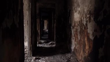The apartment of the inhabitants after the evacuation during the bombing of a peaceful city. Left belongings of residents. Bombed apartments. Fire in the house. Traces of hits from. Mariupol. Ukraine.