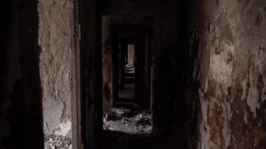 The apartment of the inhabitants after the evacuation during the bombing of a peaceful city. Left belongings of residents. Bombed apartments. Fire in the house. Traces of hits from. Mariupol. Ukraine.