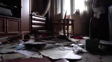 The apartment of the inhabitants after the evacuation during the bombing of a peaceful city. Left belongings of residents. Bombed apartments. Fire in the house. Traces of hits from. Mariupol. Ukraine.