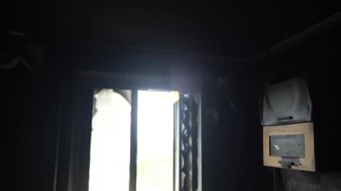 The apartment of the inhabitants after the evacuation during the bombing of a peaceful city. Left belongings of residents. Bombed apartments. Fire in the house. Traces of hits from. Mariupol. Ukraine.