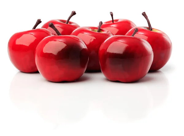 A set of seven red plastic apples — Stock Photo, Image