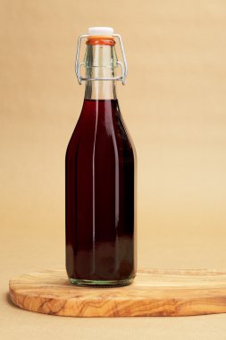Home made red wine in a classic bottle clipart