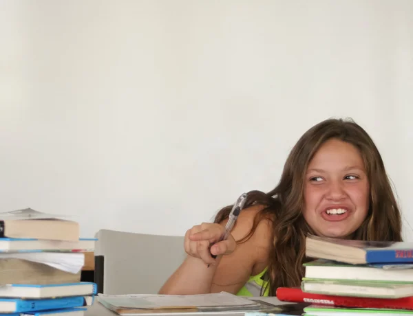 Pointing female teen student with books — Stock Photo, Image