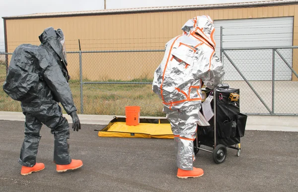 Men approaching hazmat site — Stock Photo, Image