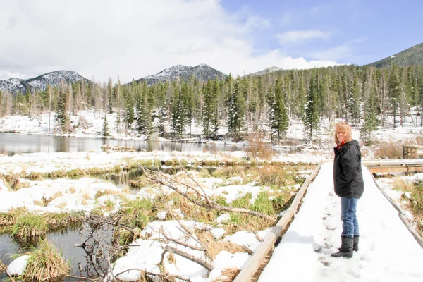 Senior female on snow covered trail — Stock Photo, Image