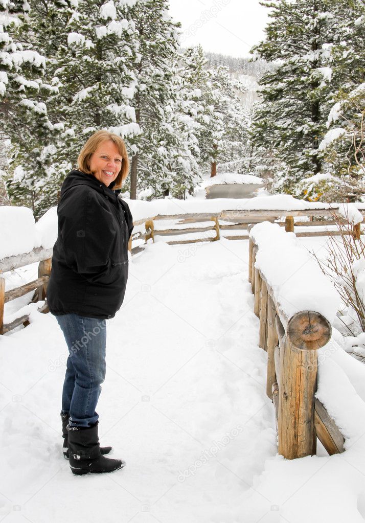 Senior female on snow covered trail
