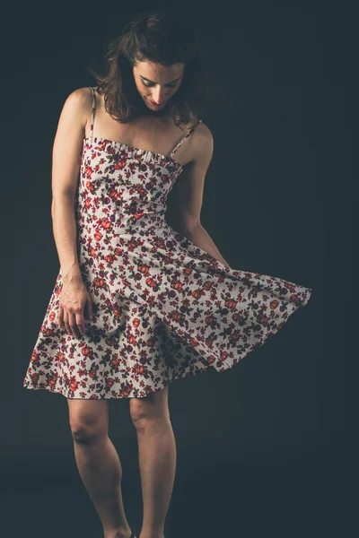 Vintage girl wearing a flowered dress — Stock Photo, Image