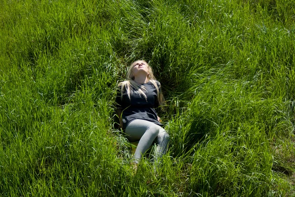 Girl, blonde lying on the grass — Stock Photo, Image