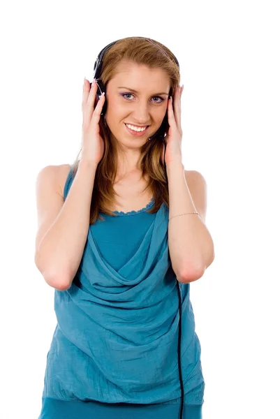 The girl in the headphones listening to the music — Stock Photo, Image