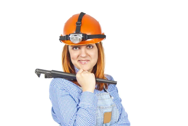 Девушка со шлемом и гаечным ключом — стоковое фото