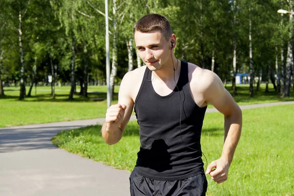 Guy running with headphones — Stock Photo, Image