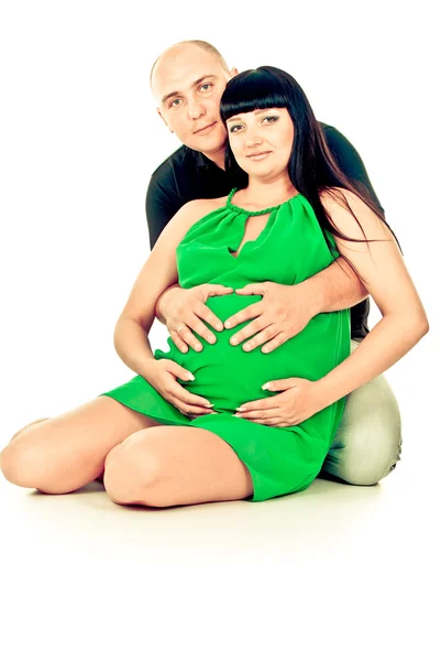 Happy pregnant couple hugging — Stok fotoğraf