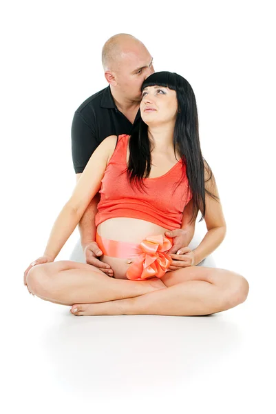 Pregnant couple with a bow — Stock Photo, Image