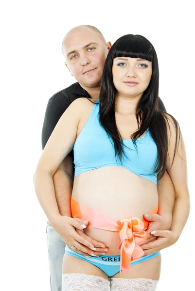 Happy husband and pregnant wife with bow Royalty Free Stock Images