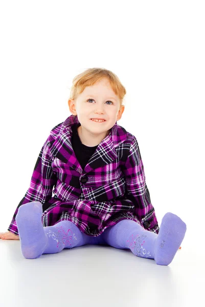 A little girl poses, lies — Stock Photo, Image