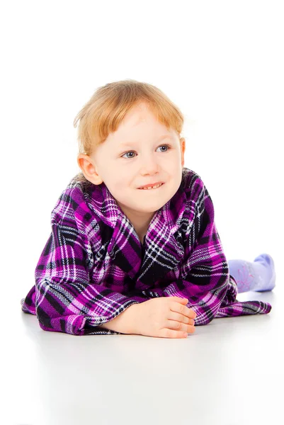 A little girl poses, lies — Stock Photo, Image