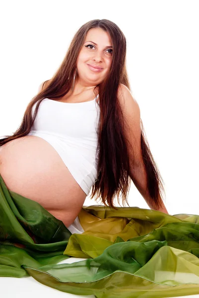 A pregnant girl in a green veil — Stock Photo, Image