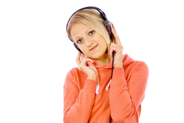 Flicka lyssnar på musik i hörlurar — Stockfoto