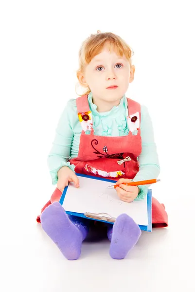 The little girl tries to draw — Stok fotoğraf