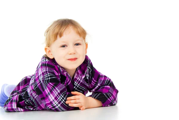 A little girl poses, lies — Stock Photo, Image