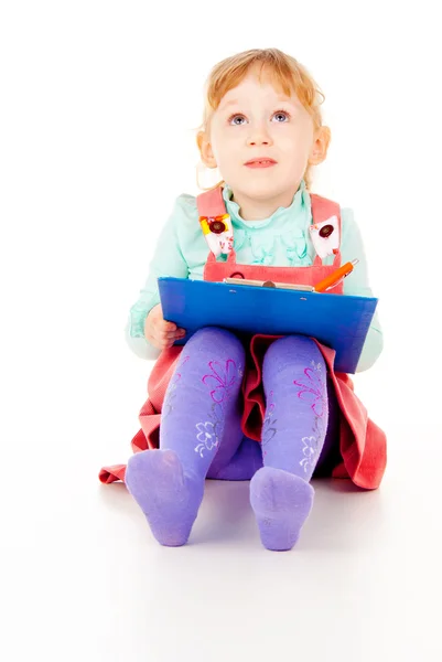 The little girl tries to draw — Stok fotoğraf