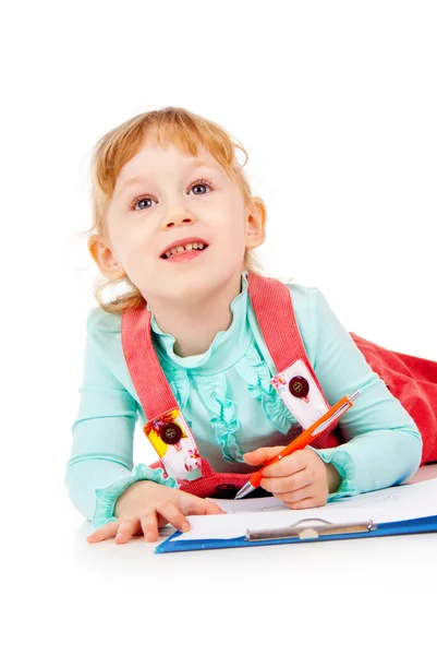 The little girl lying and draw Stock Picture