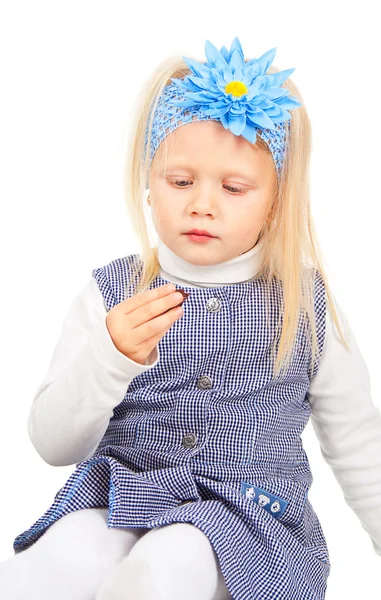 Little girl eating chocolate candy — Stock Photo, Image