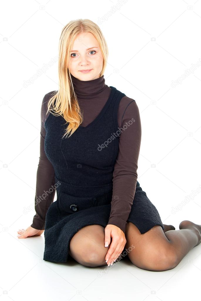 Blonde sits on a white background