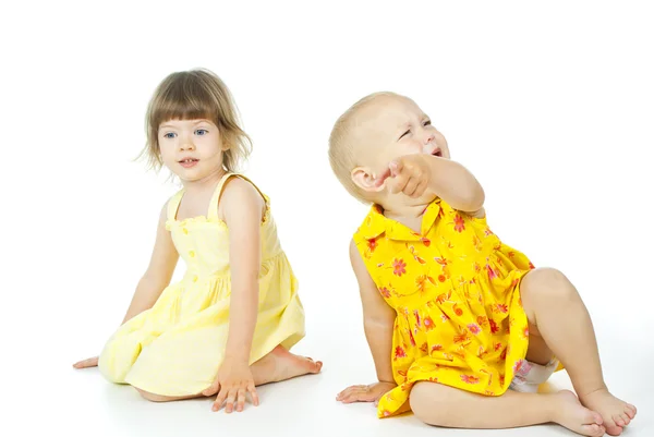 Two children sit Royalty Free Stock Images