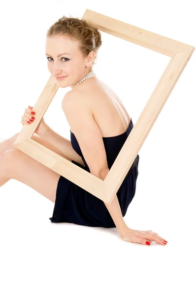 The girl is holding the frame from picture — Stock Photo, Image