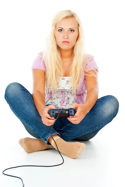 Girl playing video games on the joystick — Stock Photo, Image