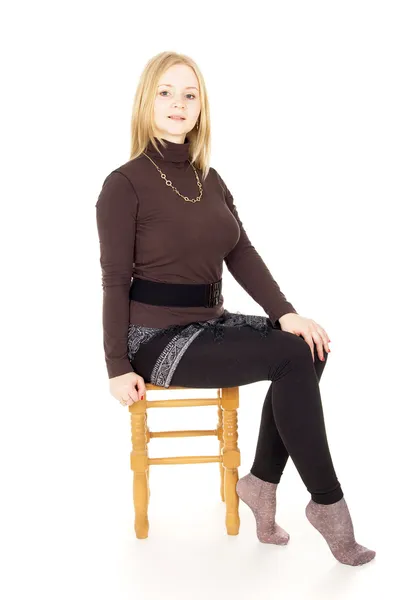 Girl sitting on a chair — Stock Photo, Image