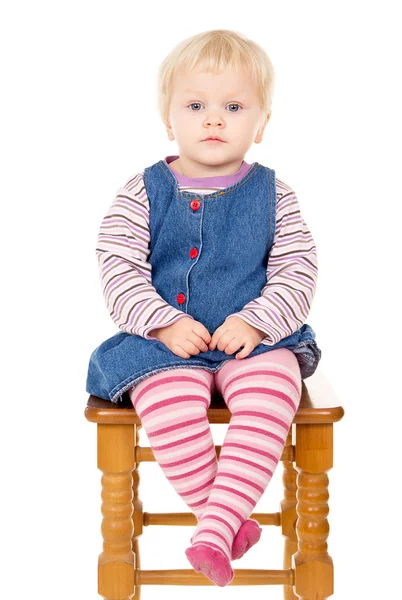 Small child sits Stock Image