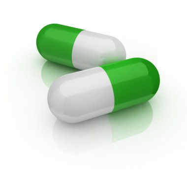 Two medical pills isolated on the white