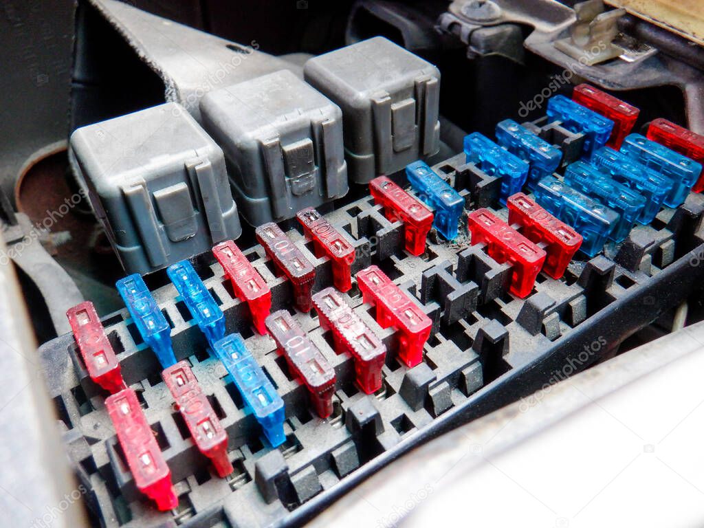 Colorful car fuse box and multiple protection fuses.