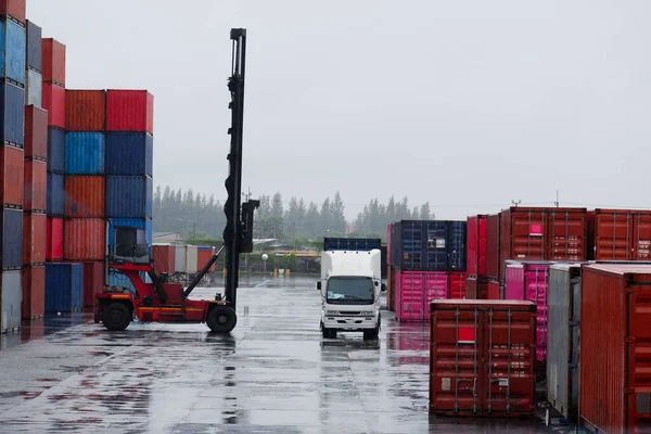 container forklift Moving containers into trucks