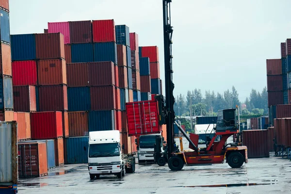 container forklift Moving containers into trucks