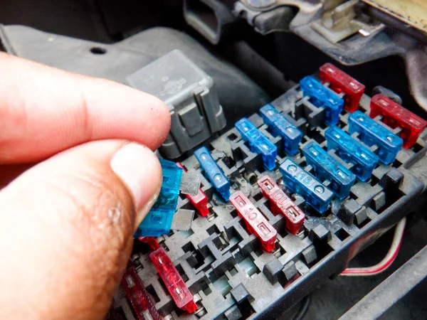 Colorful car fuse box and multiple protection fuses.