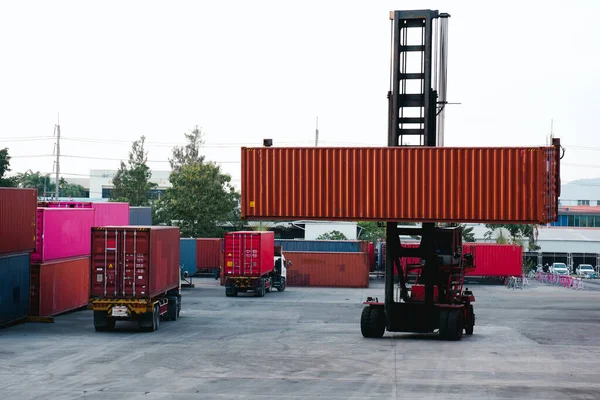 container forklift Moving containers into trucks