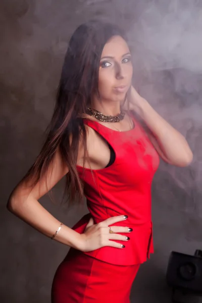 Beautiful girl in a red dress — Stock Photo, Image