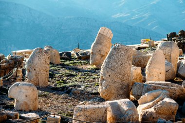 Heads of the statues on Nemrut Dag on the sunset. Travel concept photo. Adiyaman, Nemrut Mountain, Turkey