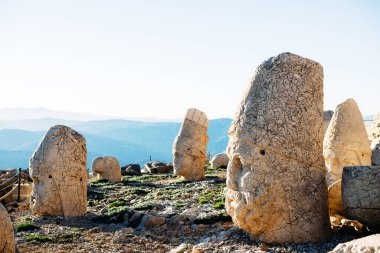 Heads of the statues on Nemrut Dag on the sunset. Travel concept photo. Adiyaman, Nemrut Mountain, Turkey