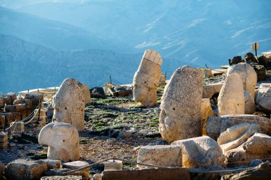 Heads of the statues on Nemrut Dag on the sunset. Travel concept photo. Adiyaman, Nemrut Mountain, Turkey