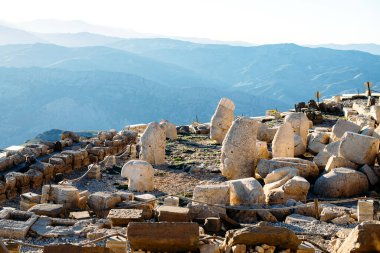 Heads of the statues on Nemrut Dag on the sunset. Travel concept photo. Adiyaman, Nemrut Mountain, Turkey
