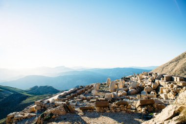 Heads of the statues on Nemrut Dag on the sunset. Travel concept photo. Adiyaman, Nemrut Mountain, Turkey