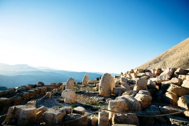 Heads of the statues on Nemrut Dag on the sunset. Travel concept photo. Adiyaman, Nemrut Mountain, Turkey
