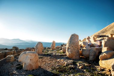 Heads of the statues on Nemrut Dag on the sunset. Travel concept photo. Adiyaman, Nemrut Mountain, Turkey