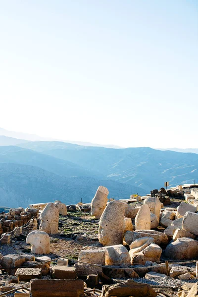 Heads of the statues on Nemrut Dag on the sunset. Travel concept photo. Adiyaman, Nemrut Mountain, Turkey