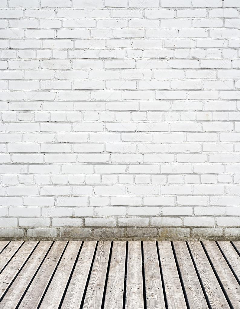 White brick wall and wooden floor